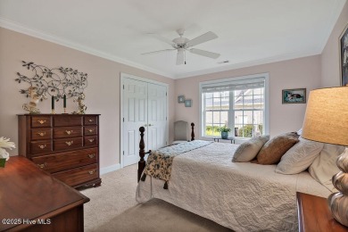 Enjoy serene pond views with this stunning brick home located in on Cape Fear National At Brunswick Forest in North Carolina - for sale on GolfHomes.com, golf home, golf lot