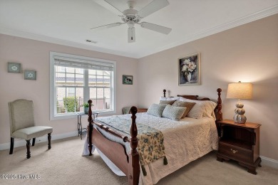 Enjoy serene pond views with this stunning brick home located in on Cape Fear National At Brunswick Forest in North Carolina - for sale on GolfHomes.com, golf home, golf lot