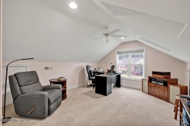 Enjoy serene pond views with this stunning brick home located in on Cape Fear National At Brunswick Forest in North Carolina - for sale on GolfHomes.com, golf home, golf lot