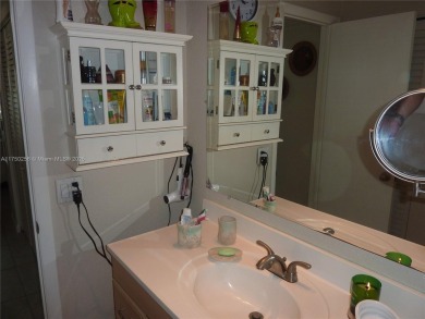 Stunning 1 bed, 1.5 bath, 1st-floor unit in 55+ community! on Sunrise Lakes Phase IV Golf Course in Florida - for sale on GolfHomes.com, golf home, golf lot