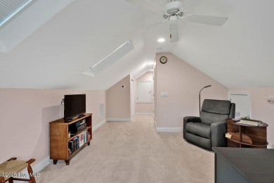 Enjoy serene pond views with this stunning brick home located in on Cape Fear National At Brunswick Forest in North Carolina - for sale on GolfHomes.com, golf home, golf lot