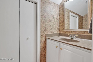 Enjoy serene pond views with this stunning brick home located in on Cape Fear National At Brunswick Forest in North Carolina - for sale on GolfHomes.com, golf home, golf lot