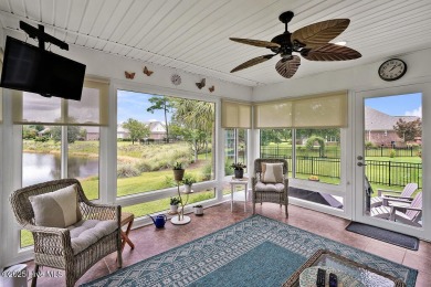 Enjoy serene pond views with this stunning brick home located in on Cape Fear National At Brunswick Forest in North Carolina - for sale on GolfHomes.com, golf home, golf lot