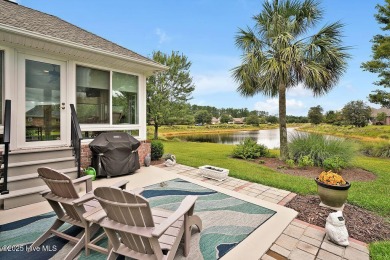 Enjoy serene pond views with this stunning brick home located in on Cape Fear National At Brunswick Forest in North Carolina - for sale on GolfHomes.com, golf home, golf lot