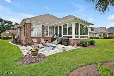 Enjoy serene pond views with this stunning brick home located in on Cape Fear National At Brunswick Forest in North Carolina - for sale on GolfHomes.com, golf home, golf lot