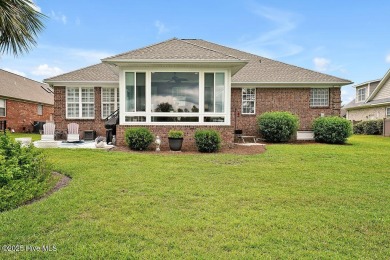 Enjoy serene pond views with this stunning brick home located in on Cape Fear National At Brunswick Forest in North Carolina - for sale on GolfHomes.com, golf home, golf lot