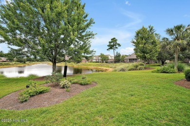 Enjoy serene pond views with this stunning brick home located in on Cape Fear National At Brunswick Forest in North Carolina - for sale on GolfHomes.com, golf home, golf lot