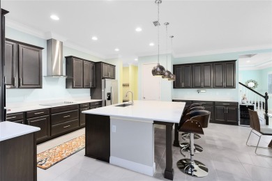 This stunning 5-bed, 5-bath Jones Homes masterpiece with water on Eagle Creek Golf Club in Florida - for sale on GolfHomes.com, golf home, golf lot