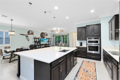 This stunning 5-bed, 5-bath Jones Homes masterpiece with water on Eagle Creek Golf Club in Florida - for sale on GolfHomes.com, golf home, golf lot