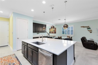 This stunning 5-bed, 5-bath Jones Homes masterpiece with water on Eagle Creek Golf Club in Florida - for sale on GolfHomes.com, golf home, golf lot