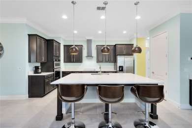 This stunning 5-bed, 5-bath Jones Homes masterpiece with water on Eagle Creek Golf Club in Florida - for sale on GolfHomes.com, golf home, golf lot
