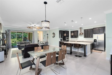 This stunning 5-bed, 5-bath Jones Homes masterpiece with water on Eagle Creek Golf Club in Florida - for sale on GolfHomes.com, golf home, golf lot