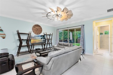 This stunning 5-bed, 5-bath Jones Homes masterpiece with water on Eagle Creek Golf Club in Florida - for sale on GolfHomes.com, golf home, golf lot