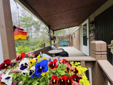Welcome to your Lake Arrowhead getaway! This charming mobile on Sand Valley Golf Course in Wisconsin - for sale on GolfHomes.com, golf home, golf lot