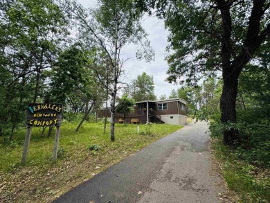 Welcome to your Lake Arrowhead getaway! This charming mobile on Sand Valley Golf Course in Wisconsin - for sale on GolfHomes.com, golf home, golf lot
