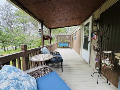 Welcome to your Lake Arrowhead getaway! This charming mobile on Sand Valley Golf Course in Wisconsin - for sale on GolfHomes.com, golf home, golf lot