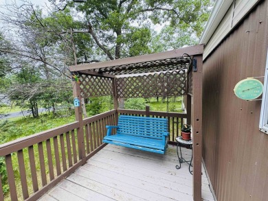Welcome to your Lake Arrowhead getaway! This charming mobile on Sand Valley Golf Course in Wisconsin - for sale on GolfHomes.com, golf home, golf lot