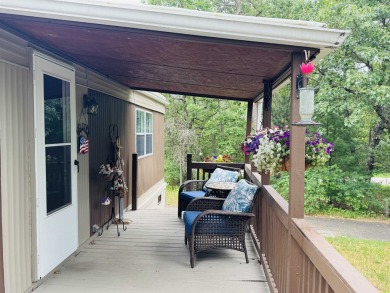 Welcome to your Lake Arrowhead getaway! This charming mobile on Sand Valley Golf Course in Wisconsin - for sale on GolfHomes.com, golf home, golf lot