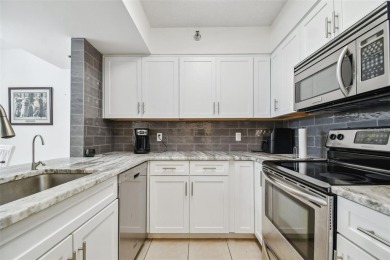 Discover this beautifully updated 2-bedroom, 2-bathroom condo on Feather Sound Country Club in Florida - for sale on GolfHomes.com, golf home, golf lot