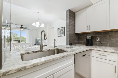Discover this beautifully updated 2-bedroom, 2-bathroom condo on Feather Sound Country Club in Florida - for sale on GolfHomes.com, golf home, golf lot