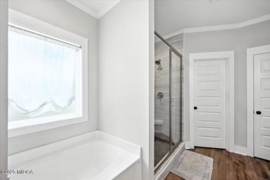 Welcome to this beautifully designed 5-bedroom, 4-bath home in on Canongate At Healy Point Country Club in Georgia - for sale on GolfHomes.com, golf home, golf lot