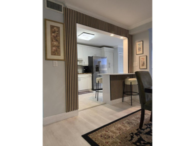 This stunning first-floor condo offers a spacious and modern on Boca Pointe Country Club in Florida - for sale on GolfHomes.com, golf home, golf lot