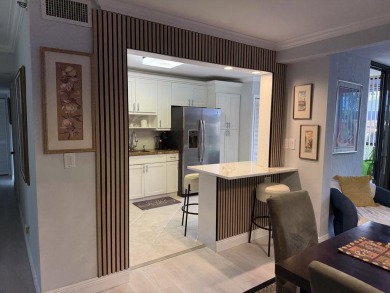 This stunning first-floor condo offers a spacious and modern on Boca Pointe Country Club in Florida - for sale on GolfHomes.com, golf home, golf lot