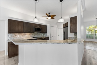 Welcome to your private oasis in the highly sought-after gated on Calusa Lakes Golf Club in Florida - for sale on GolfHomes.com, golf home, golf lot