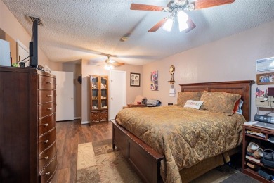 Located in the gated community of Hideaway Lake, this inviting on Hide-A-Way Lake Golf Course in Texas - for sale on GolfHomes.com, golf home, golf lot