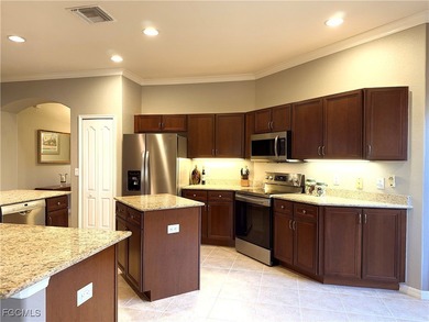 THIS LOVELY HOME IS A MUST SEE TO BELIEVE! This Lovely Home has on Gateway Golf and Country Club in Florida - for sale on GolfHomes.com, golf home, golf lot