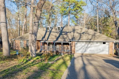 Located in the gated community of Hideaway Lake, this inviting on Hide-A-Way Lake Golf Course in Texas - for sale on GolfHomes.com, golf home, golf lot