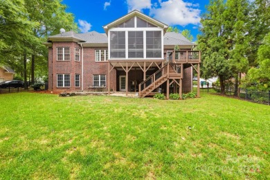 Nestled in the prestigious Shannamara community, this brick on The Divide Golf Club in North Carolina - for sale on GolfHomes.com, golf home, golf lot