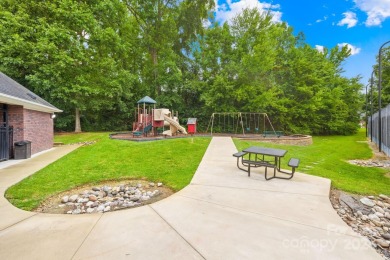 Nestled in the prestigious Shannamara community, this brick on The Divide Golf Club in North Carolina - for sale on GolfHomes.com, golf home, golf lot