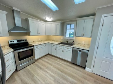 This Water View/Golf Course View Home has been renovated by the on Water Oak Country Club Estates in Florida - for sale on GolfHomes.com, golf home, golf lot