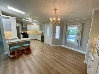 This Water View/Golf Course View Home has been renovated by the on Water Oak Country Club Estates in Florida - for sale on GolfHomes.com, golf home, golf lot