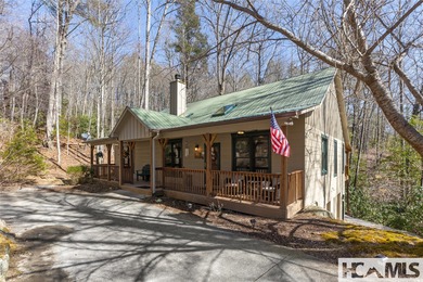 Step into the Highlands-Cashiers Plateau lifestyle with this on Sapphire National Golf Club in North Carolina - for sale on GolfHomes.com, golf home, golf lot