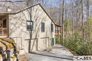 Step into the Highlands-Cashiers Plateau lifestyle with this on Sapphire National Golf Club in North Carolina - for sale on GolfHomes.com, golf home, golf lot