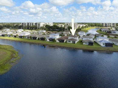 Stunning, move-in ready home with long lake views in the 55+ on Marina Lakes Golf Course in Florida - for sale on GolfHomes.com, golf home, golf lot