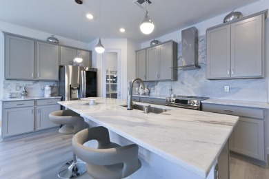 Stunning, move-in ready home with long lake views in the 55+ on Marina Lakes Golf Course in Florida - for sale on GolfHomes.com, golf home, golf lot