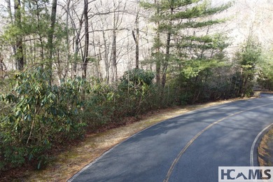 This prime building site offers potential mountain views of the on Sapphire National Golf Club in North Carolina - for sale on GolfHomes.com, golf home, golf lot