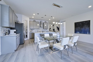 Stunning, move-in ready home with long lake views in the 55+ on Marina Lakes Golf Course in Florida - for sale on GolfHomes.com, golf home, golf lot