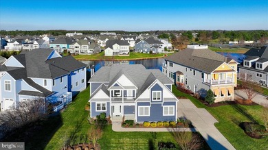 The welcoming covered entry of 33418 Islander Drive invites you on The Peninsula Golf and Country Club in Delaware - for sale on GolfHomes.com, golf home, golf lot