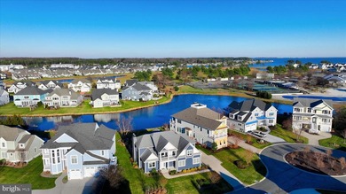 The welcoming covered entry of 33418 Islander Drive invites you on The Peninsula Golf and Country Club in Delaware - for sale on GolfHomes.com, golf home, golf lot