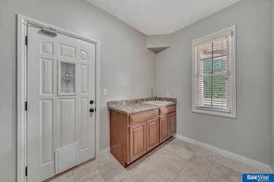 Nestled among the scenic Hi-Mark golf couse, this stunning on Pine Lake Golf and Tennis Club in Nebraska - for sale on GolfHomes.com, golf home, golf lot