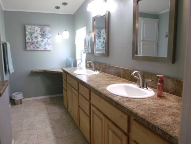 Discover this stunning 3-bedroom Palm Harbor home, offering a on Schalamar Creek Golf and Country Club in Florida - for sale on GolfHomes.com, golf home, golf lot