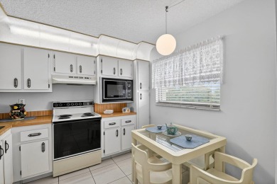 Penthouse views in this 1 BR, 1.5 BA with Den that can be used on Poinciana Golf Club in Florida - for sale on GolfHomes.com, golf home, golf lot