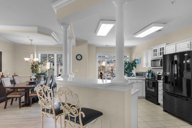 Sunlight pours into this bright, open 3-bedroom, 2-bath end-unit on Barefoot Resort and Golf Club  in South Carolina - for sale on GolfHomes.com, golf home, golf lot