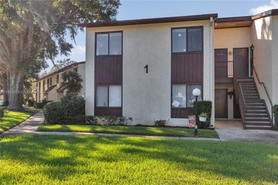 55+ COMMUNITY. GORGEOUS, TWO-BEDROOM/1.5 BATHS, SECOND-FLOOR END on Rolling Greens Executive Golf Community in Florida - for sale on GolfHomes.com, golf home, golf lot