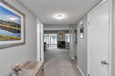 55+ COMMUNITY. GORGEOUS, TWO-BEDROOM/1.5 BATHS, SECOND-FLOOR END on Rolling Greens Executive Golf Community in Florida - for sale on GolfHomes.com, golf home, golf lot