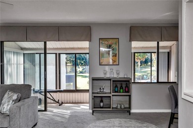 55+ COMMUNITY. GORGEOUS, TWO-BEDROOM/1.5 BATHS, SECOND-FLOOR END on Rolling Greens Executive Golf Community in Florida - for sale on GolfHomes.com, golf home, golf lot